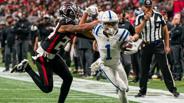 Dec 24, 2023; Atlanta, Georgia, USA; Indianapolis Colts wide receiver Josh Downs (1) runs against Atlanta Falcons cornerback A.J. Terrell (24) after a catch during the second half at Mercedes-Benz Stadium.